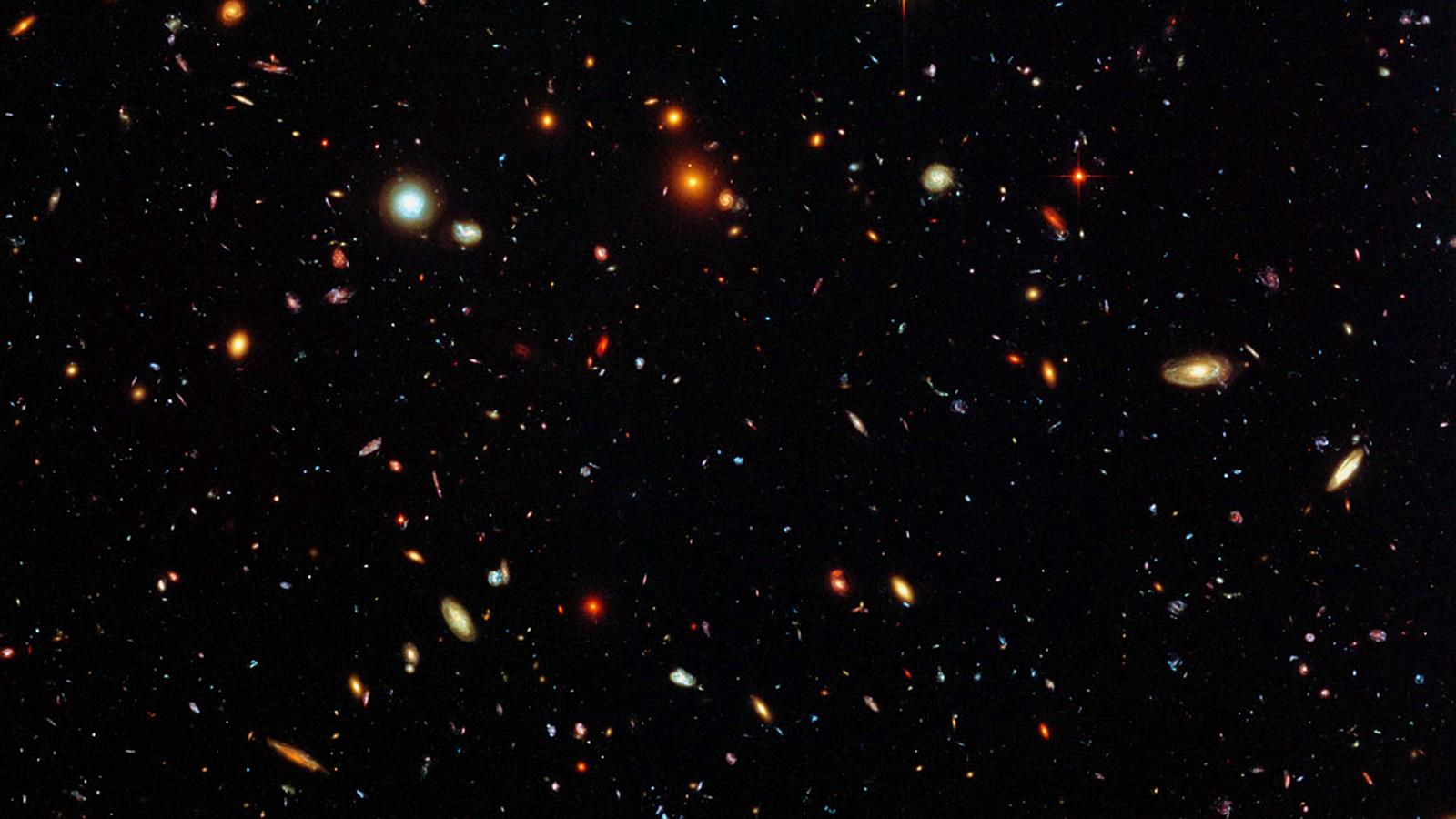 Hubble deep field: faint distant galaxies on a near-black sky (NASA, public domain)